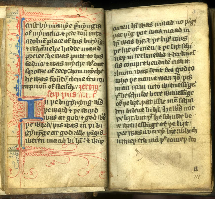 An open illuminated manuscript of the Wycliffe translation of the Bible