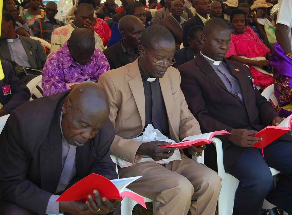 Pastors read the New Testament in Lugwere