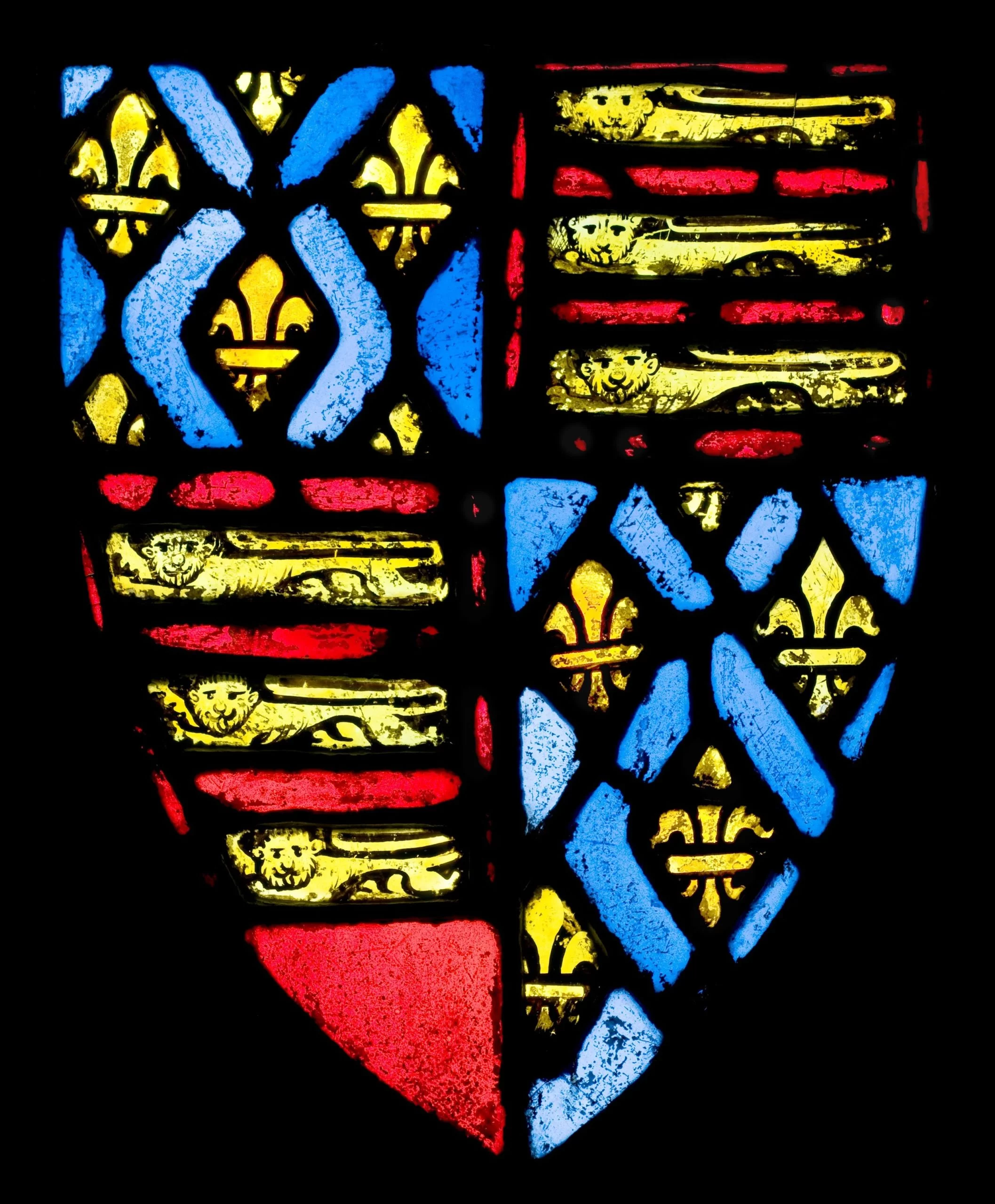 A stained glass window showing the coat of arms of Edward III