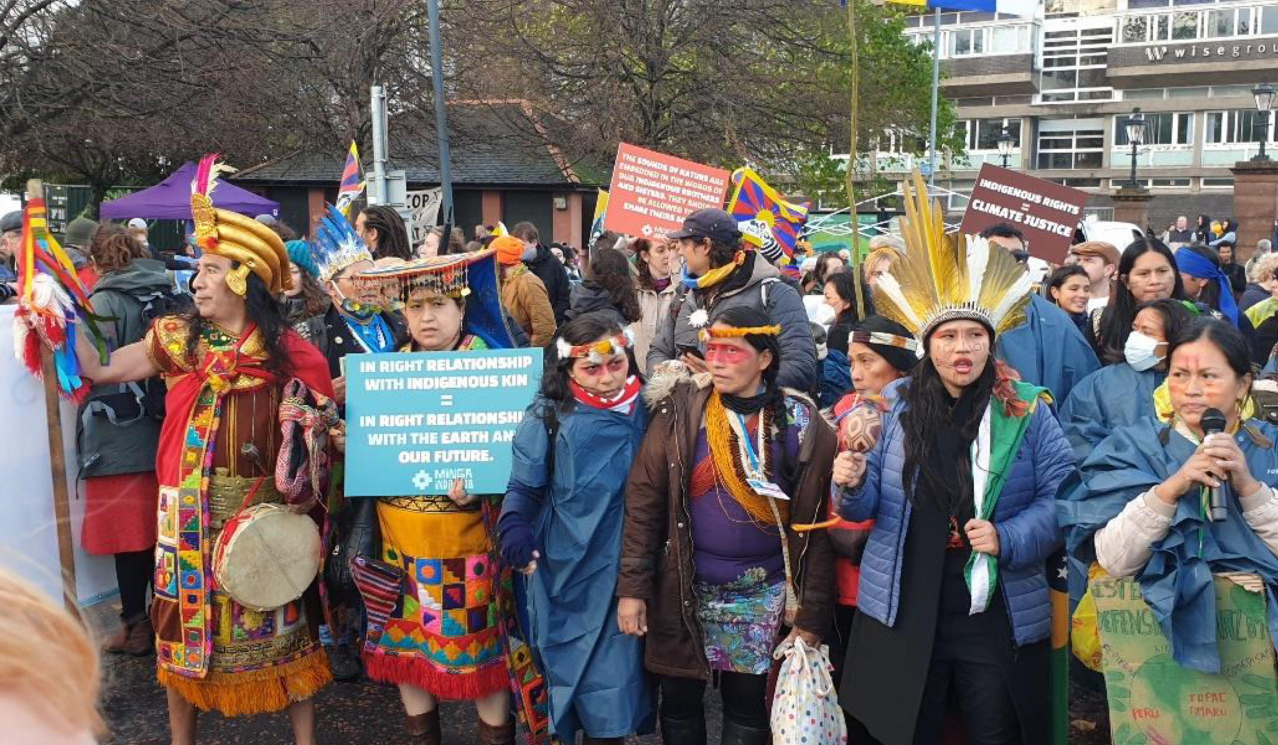Image of indigenous peoples marching at COP26