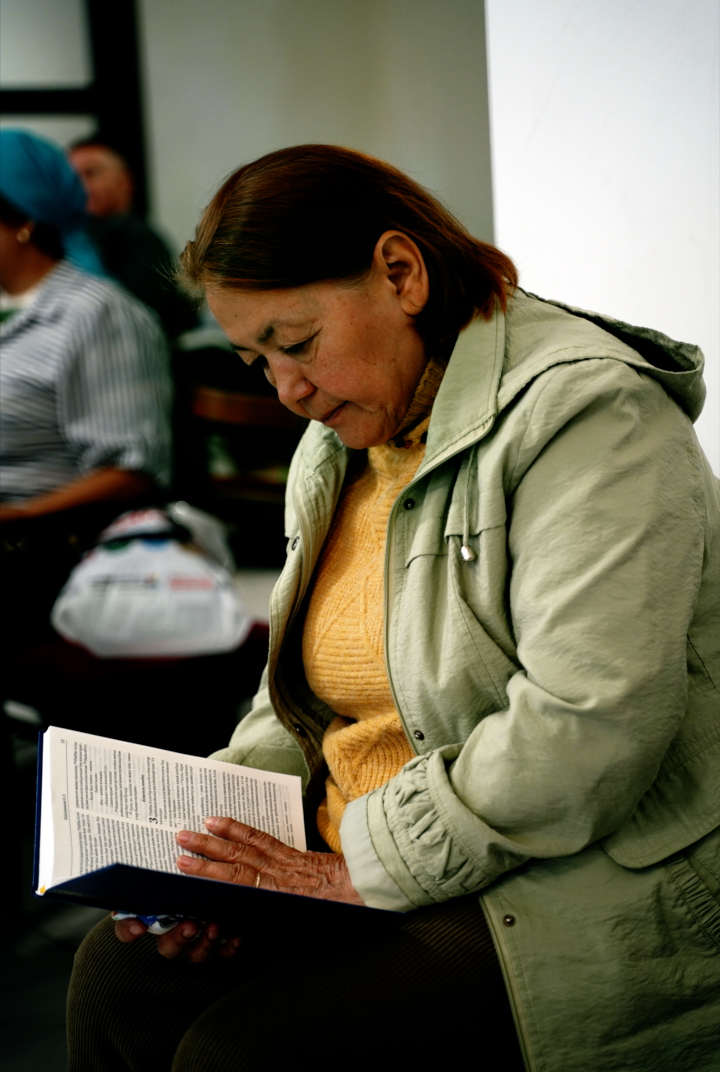 Image of a Bashkir woman reading her newly launched Bible