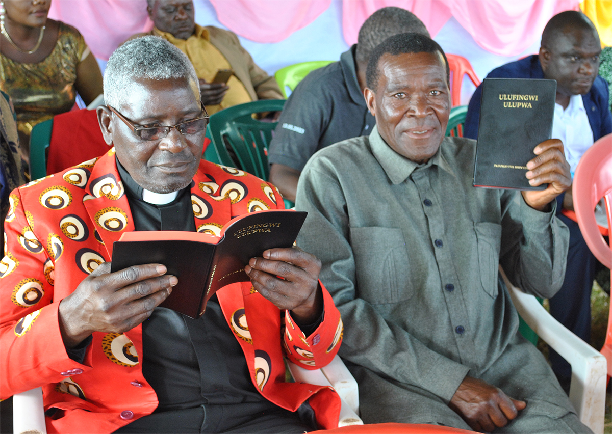 Image of two men with their Nyiha New Testaments