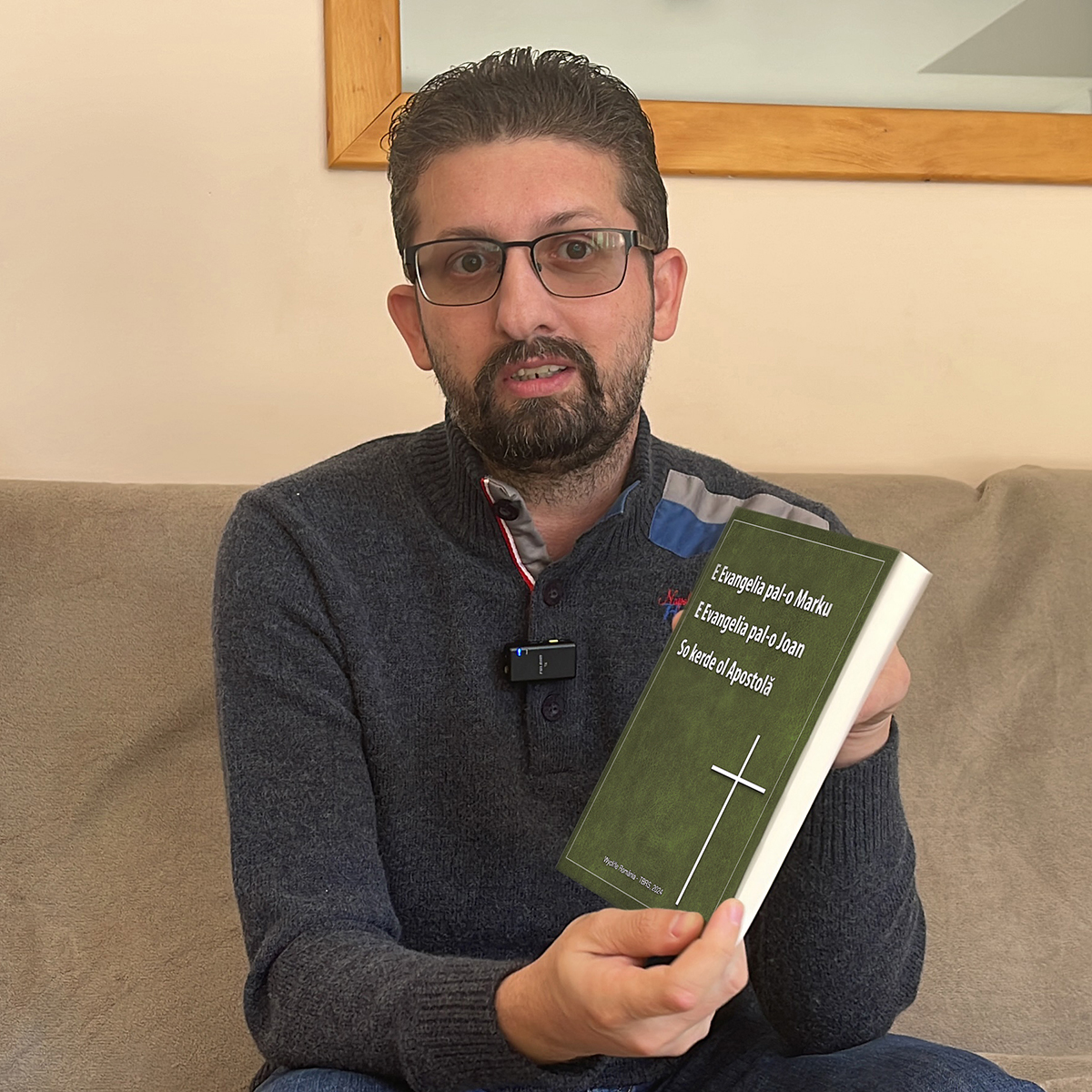 Image of Bible translator Florin with his newly launched Standard Romani edition of Mark, John and Acts