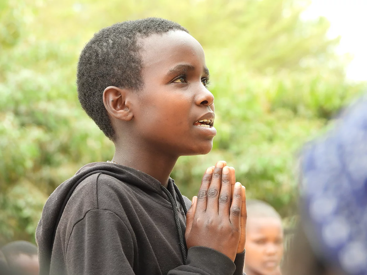 Image of a girl recites the story of the Prodigal Son at the launch of the Rangi New Testament