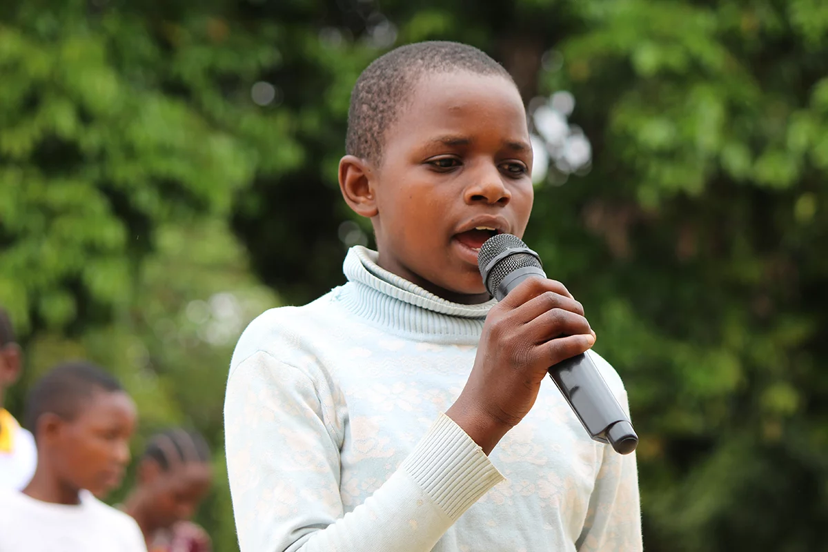 Image of a girl speaking memory verses in the Rangi language