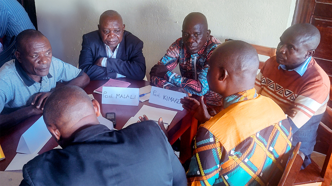 Image of the Bira and Hema Bible translators working together in DRC