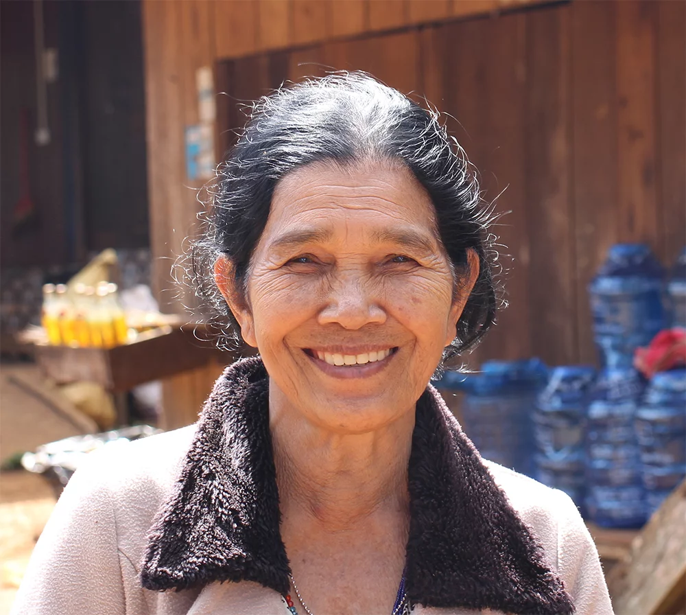 Image of Leun, a Bunong speaker in Cambodia, who says Thank you for your support in translating the New Testament into her language
