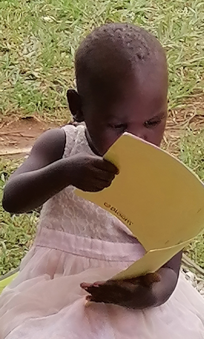 Image of a young girl reading Scripture in her language at a ‘Let’s Read Together’ group in Uganda